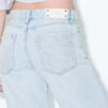 Džíny s nízkým pasem a Wide Leg nohavicemi s hvězdicovým detailem Džíny s nízkým pasem a Wide Leg nohavicemi s hvězdicovým detailem