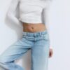 Džíny s nízkým pasem a Wide Leg nohavicemi s hvězdicovým detailem Džíny s nízkým pasem a Wide Leg nohavicemi s hvězdicovým detailem