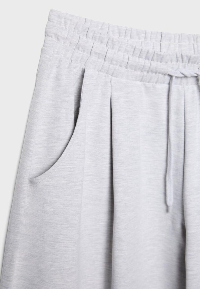 Joggingové kalhoty s balonovými nohavicemi a záševky