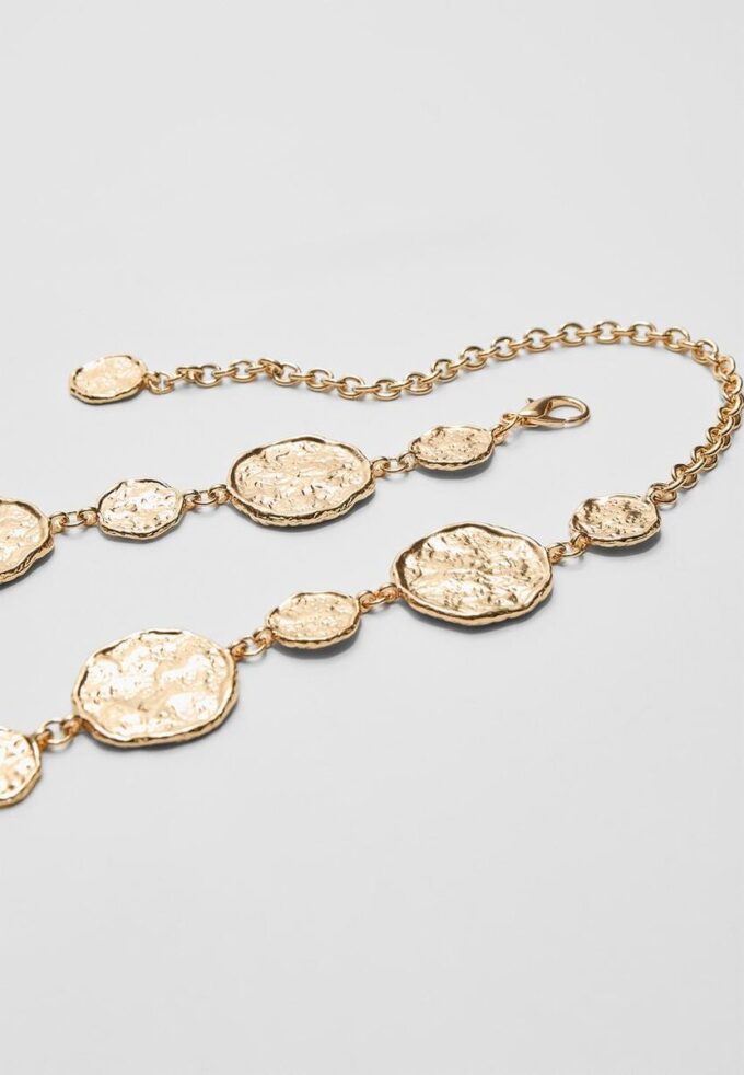 Kovový pásek s kulatými destičkami