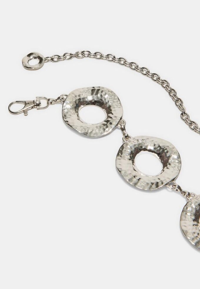 Kovový pásek s kulatými destičkami