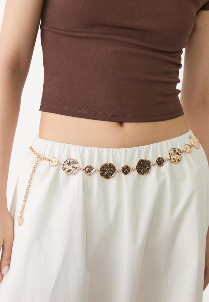 Kovový pásek s kulatými destičkami